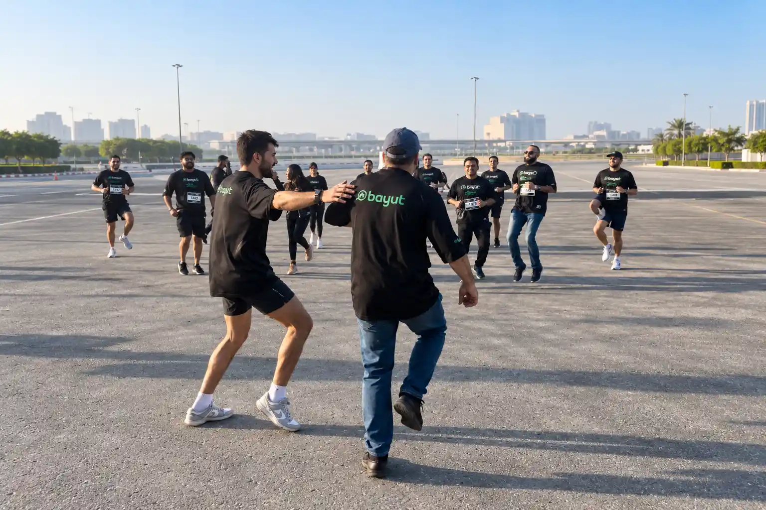 Darryl Rees hosting a warm-up session for participants at the Bayut 5KM Run in Dubai.