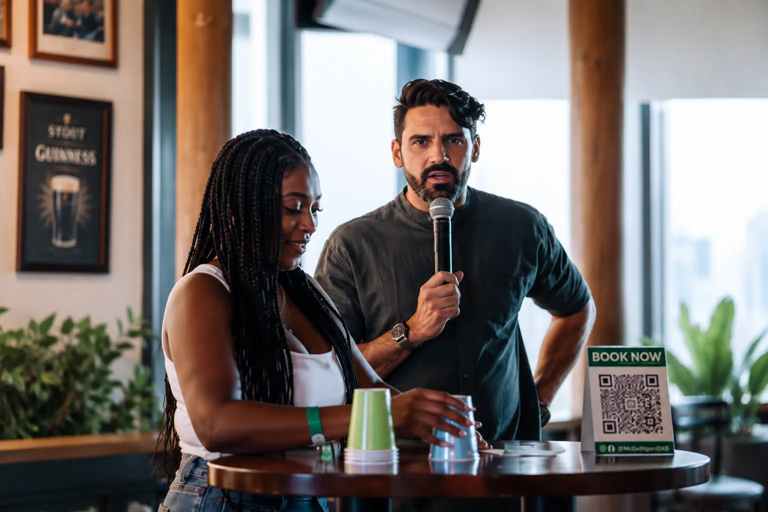 Professional quiz master engaging a participant during a corporate quiz night in Dubai, encouraging audience interaction and team-building in a lively pub atmosphere.
